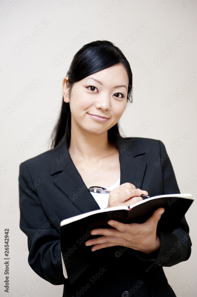 portrait of japanese business woman taking notebook portrait of japanese business woman taking notebook