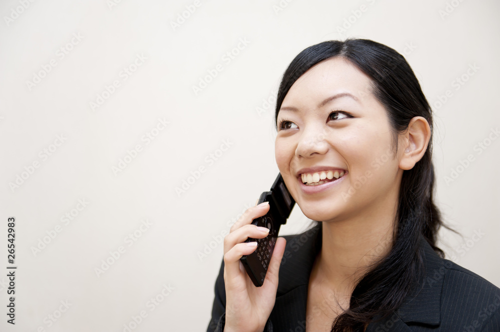 portrait of japanese business woman spearking on mobile phone portrait of japanese business woman spearking on mobile phone