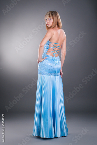 pretty white woman wearing blue evening dress