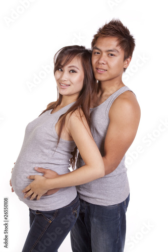 Pregnant couple in gray