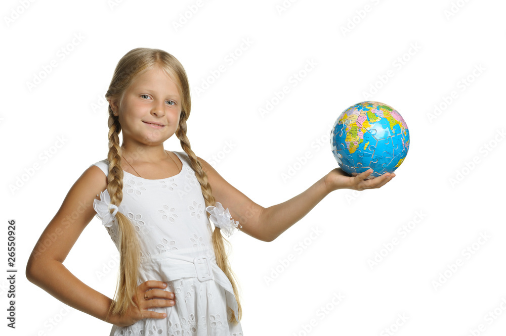 The girl holds the globe collected from puzzle in hands. Selecti The girl holds the globe collected from puzzle in hands. Selecti