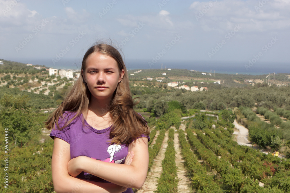 Teen poses in vineyard
