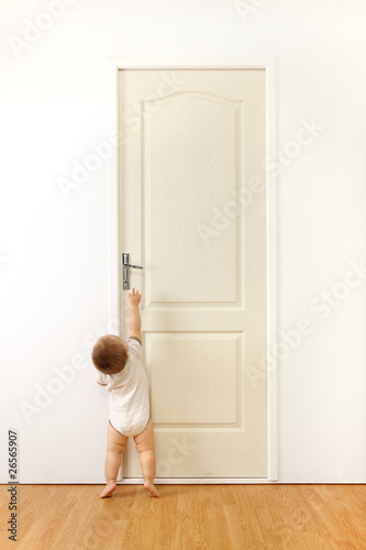 Baby in front of door