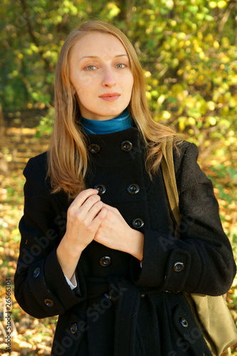Blonde young woman on autumn background © Valerii Evlakhov