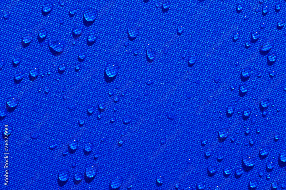 water drops on blue fabric water drops on blue fabric