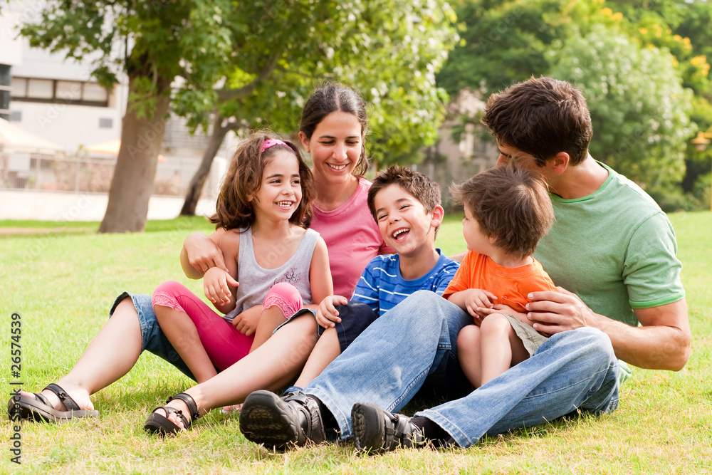 Happy family having fun in the park Happy family having fun in the park