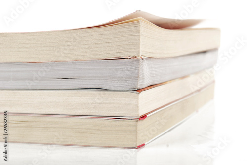 Stack of books on white background