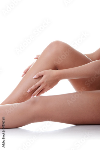 Woman holding on leg.