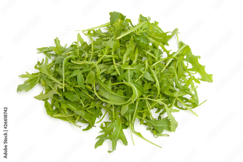 Pile of fresh Ruccola lettuce over white background Pile of fresh Ruccola lettuce over white background