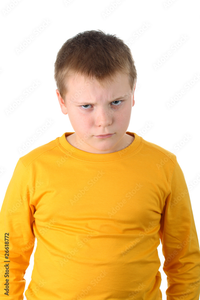 Angry 10 year old boy isolated on white Angry 10 year old boy isolated on white