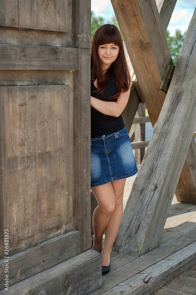 Fototapeta premium Beauty girl on the old-time bridge.