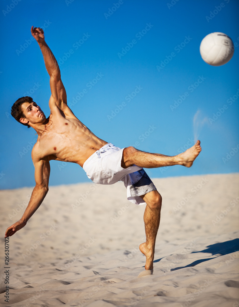 Obraz premium Young man playing soccer