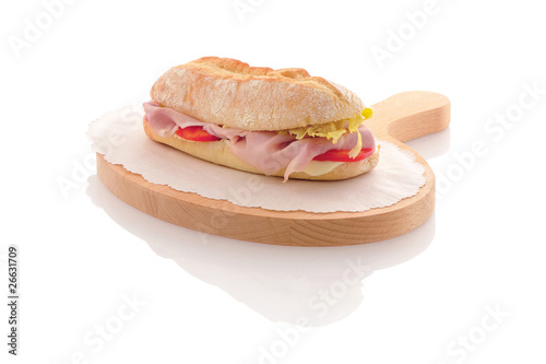 panino farcito su tagliere in legno photo