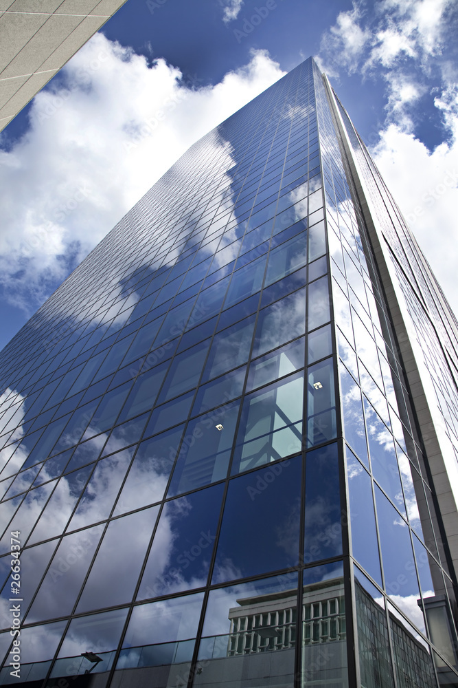 High modern skyscraper on a background of the blue sky High modern skyscraper on a background of the blue sky