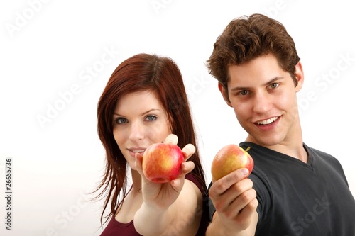young couple with apples (focus on faces)