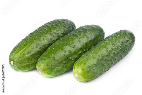 A fresh green cucumber isolated on a white background