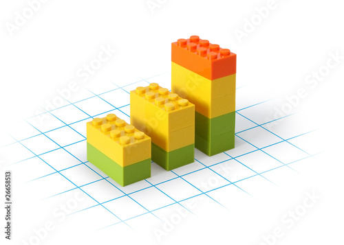Business graph blocks on grid showing growth
