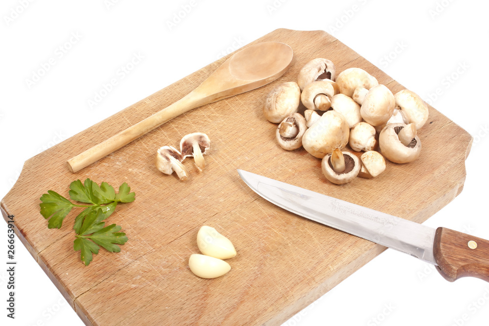 Mushrooms, parsley and garlic on a wooden board Mushrooms, parsley and garlic on a wooden board