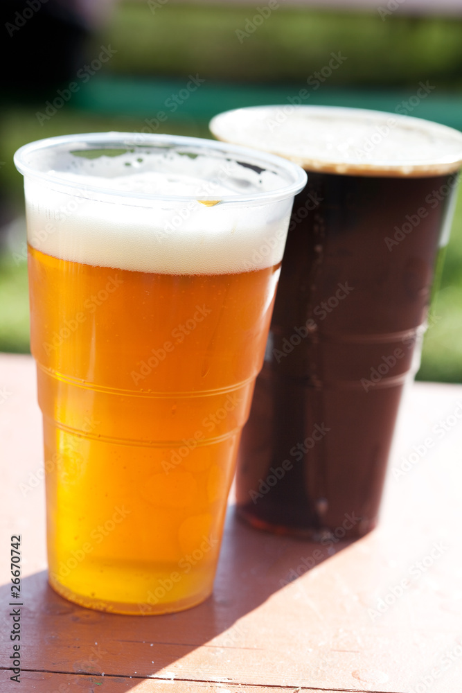 glass of light and dark beer on the table glass of light and dark beer on the table
