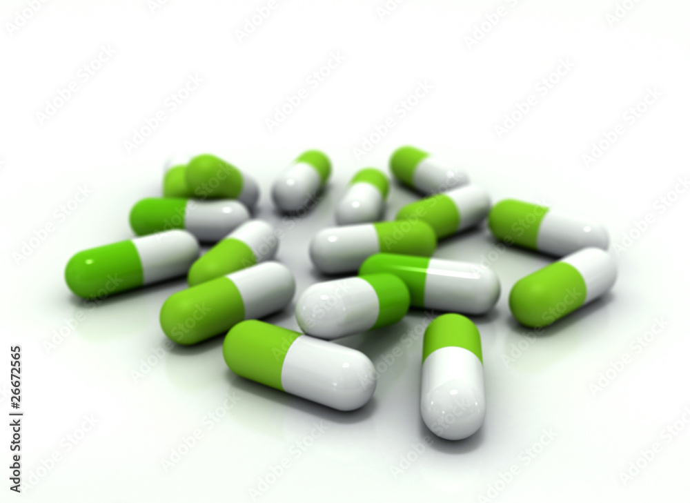 Green medical pills on white background Green medical pills on white background