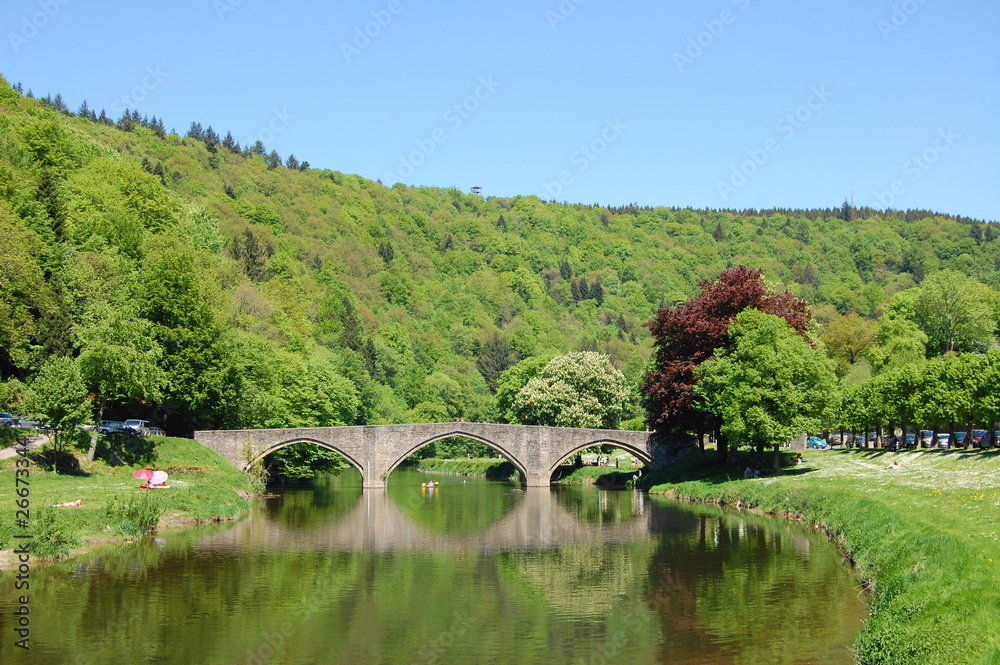 Old architecture bridge on a river, Bouillon city, Belgium