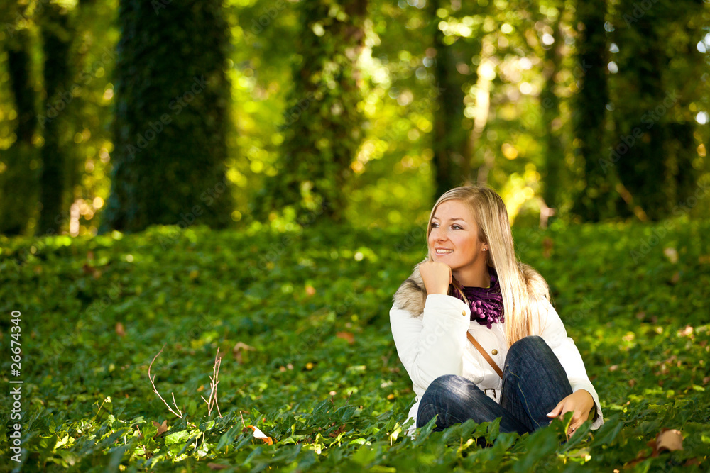 Caucasian young adult blond woman outdoor fall time Caucasian young adult blond woman outdoor fall time