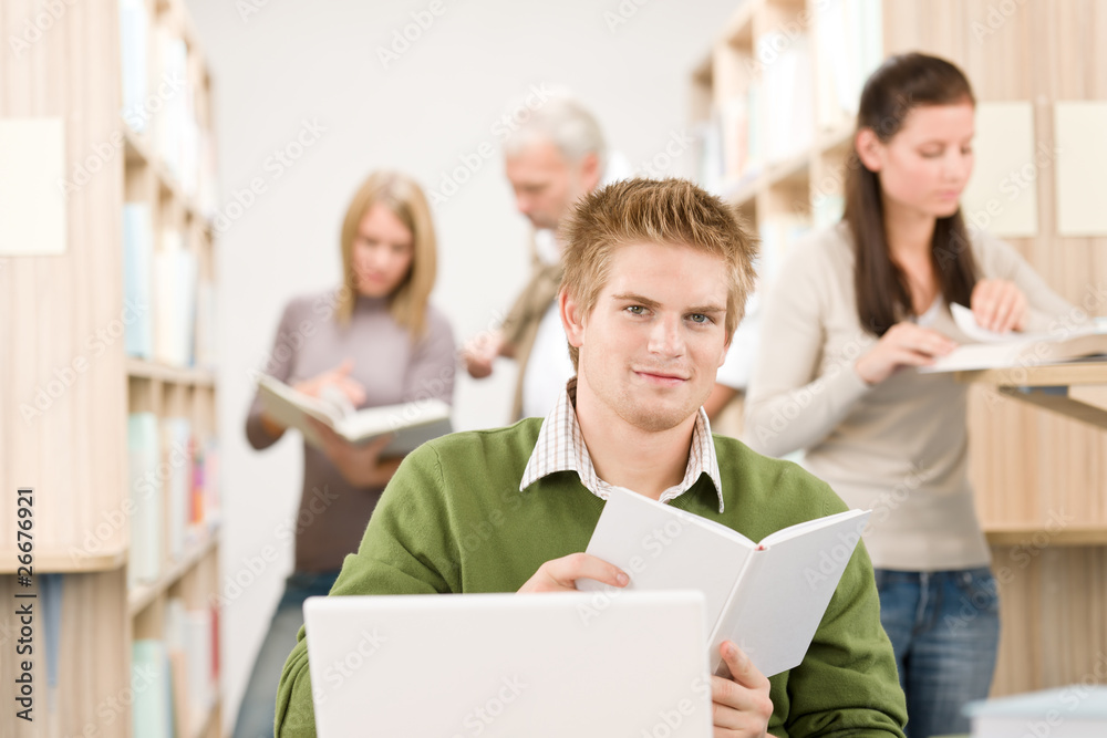 High school library - Student with book High school library - Student with book