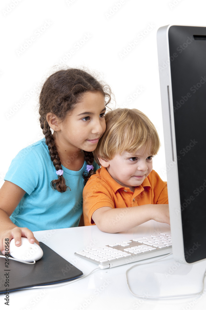 young boy and girl with desktop computer young boy and girl with desktop computer