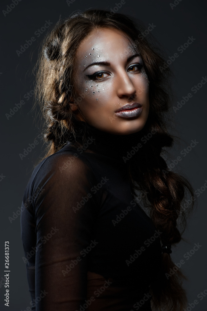 Portrait of beautiful young woman with glamour makeup