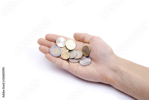 Hand with coins. Euro and roubles