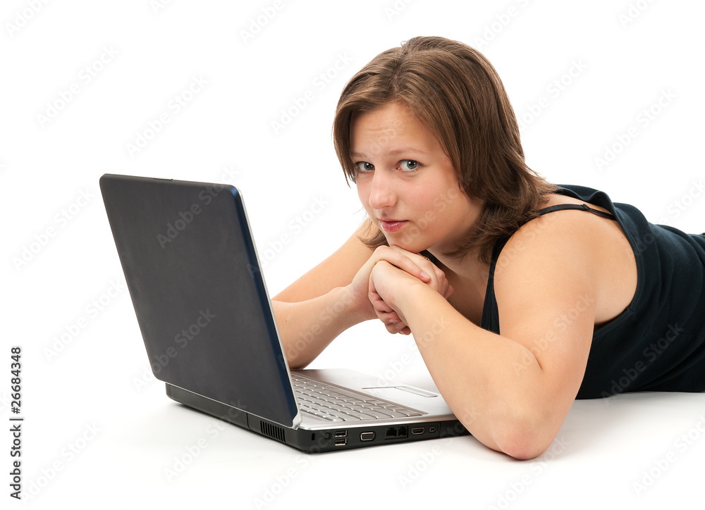 Woman working on a laptop isolated over a white background Woman working on a laptop isolated over a white background