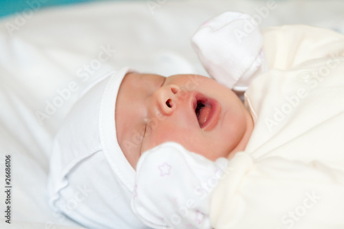 Cute newborn baby sleep on bed