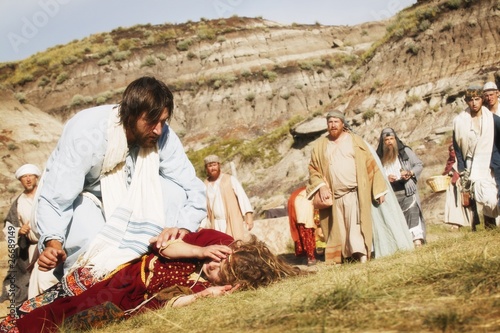 Fotobehang Crowd Watches As Jesus Helps Person Lying On Ground