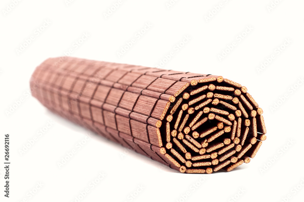 Obraz premium Rolled bamboo mat isolated on white background