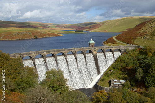 Craig Goch reservoir with water overflowing, Elan Valley, Wales. photo