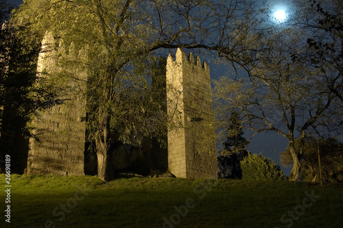 Guimaraes Castle at moonlight, Guimarães, north of Portugal photo