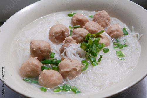 close up of meat ball soup with rice vermicelli