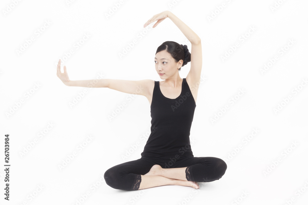 Asian model doing yoga on white background