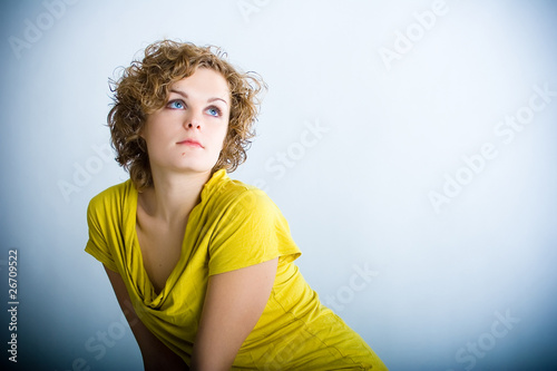 Pretty glam woman with curly hair