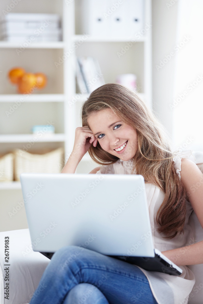 Fototapeta premium Beautiful girl with a laptop at home