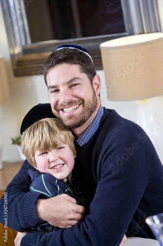 Jewish father and young son wearing yarmulkes