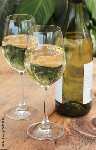 Glasses & Bottle of White Wine on Table