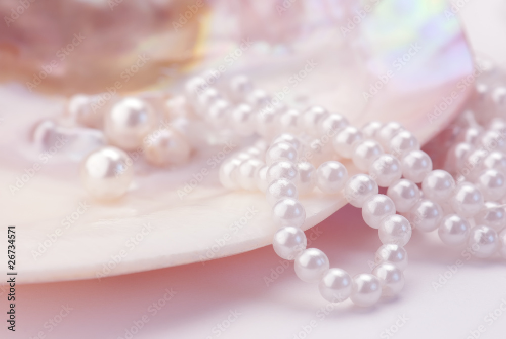 Macro of pearls and necklace in an oyster shell. Pink tinted Macro of pearls and necklace in an oyster shell. Pink tinted