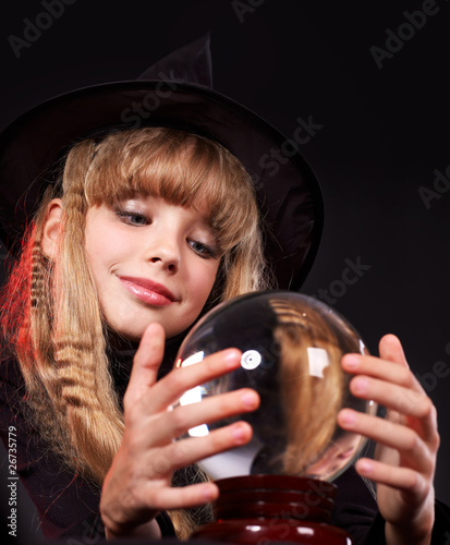 Child holding crystal ball.