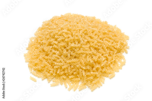 heap of raw pasta on the white background
