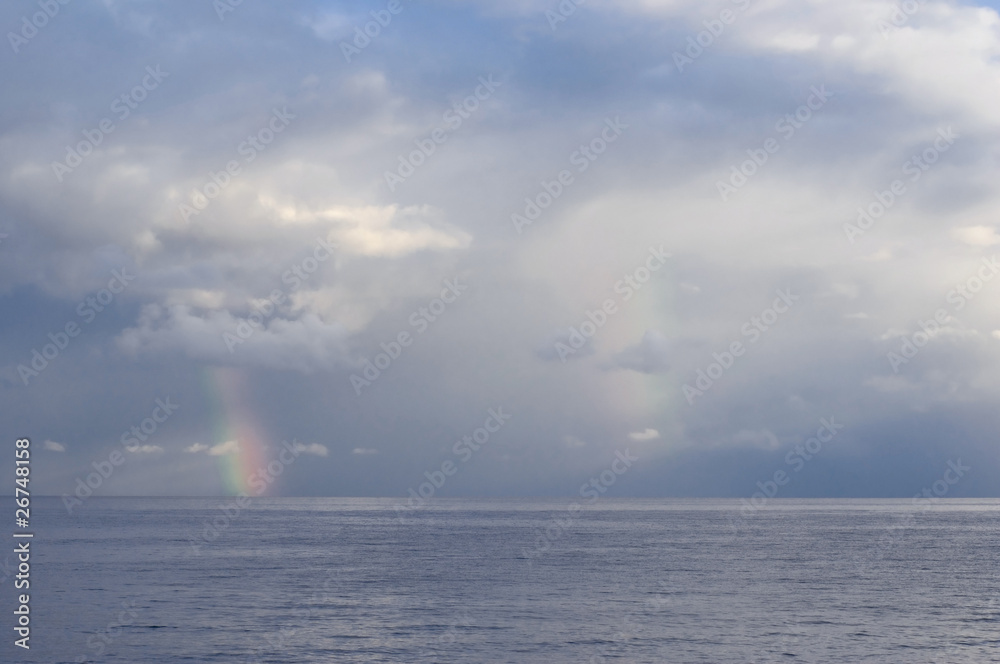 Black Sea landscape with rainbow and cloudy sky.