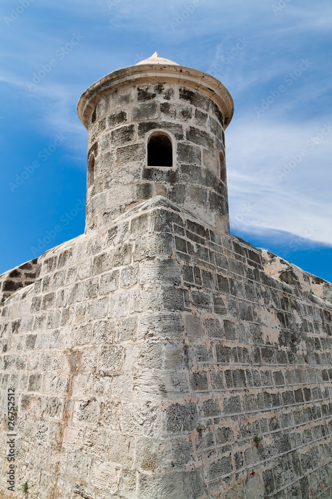 Tower of an old castle with a beautiful blue sky background