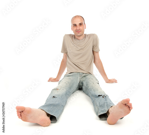 relaxed man sitting on the floor