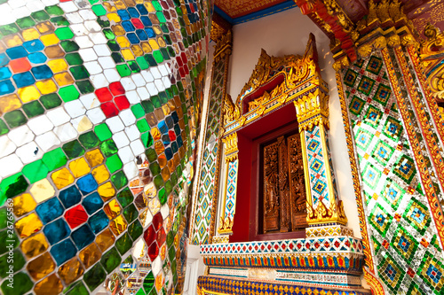 colorful mosaic window with mosaic frame in buddhist thai temple