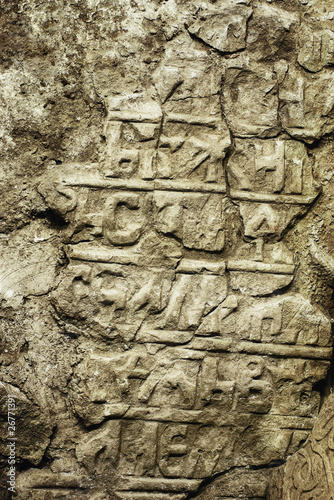 Grungy ancient tombstone with old Slavonic inscriptions